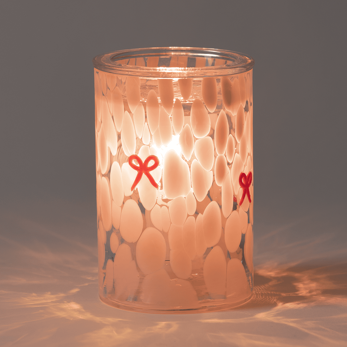 Scentsy First Blush Warmer in a Dark Room glowing