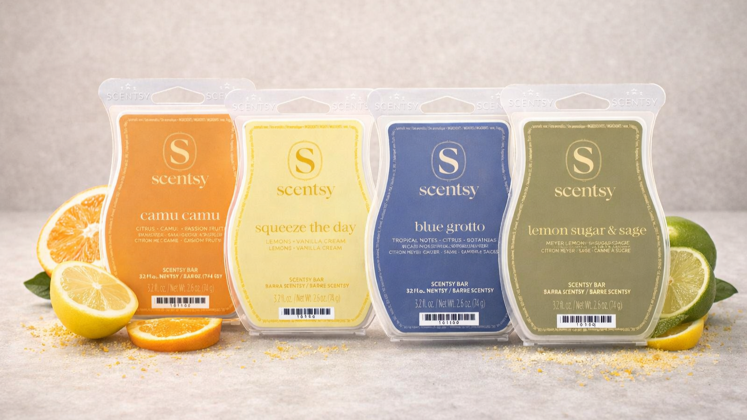 Four Scentsy citrus wax bars — Camu Camu, Squeeze the Day, Blue Grotto and Lemon Sugar & Sage — styled on a soft neutral background with fresh lemon, orange and lime accents.