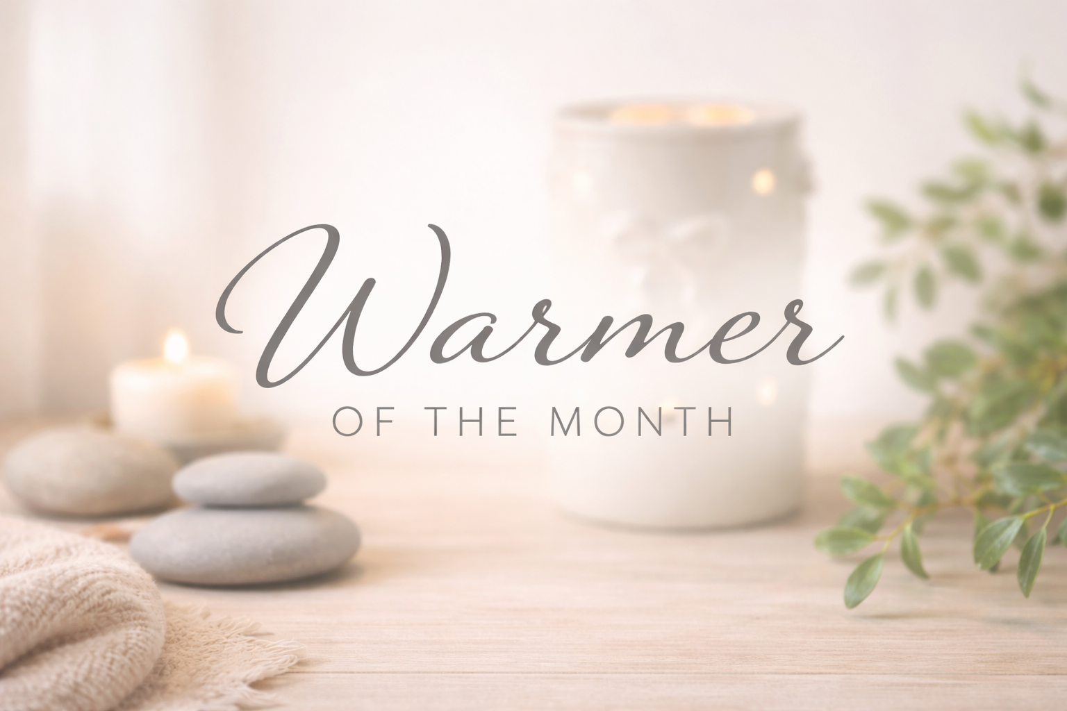 Scentsy Warmer of the Month graphic with a softly blurred wax warmer in the background, styled in a calm, spa-inspired setting.