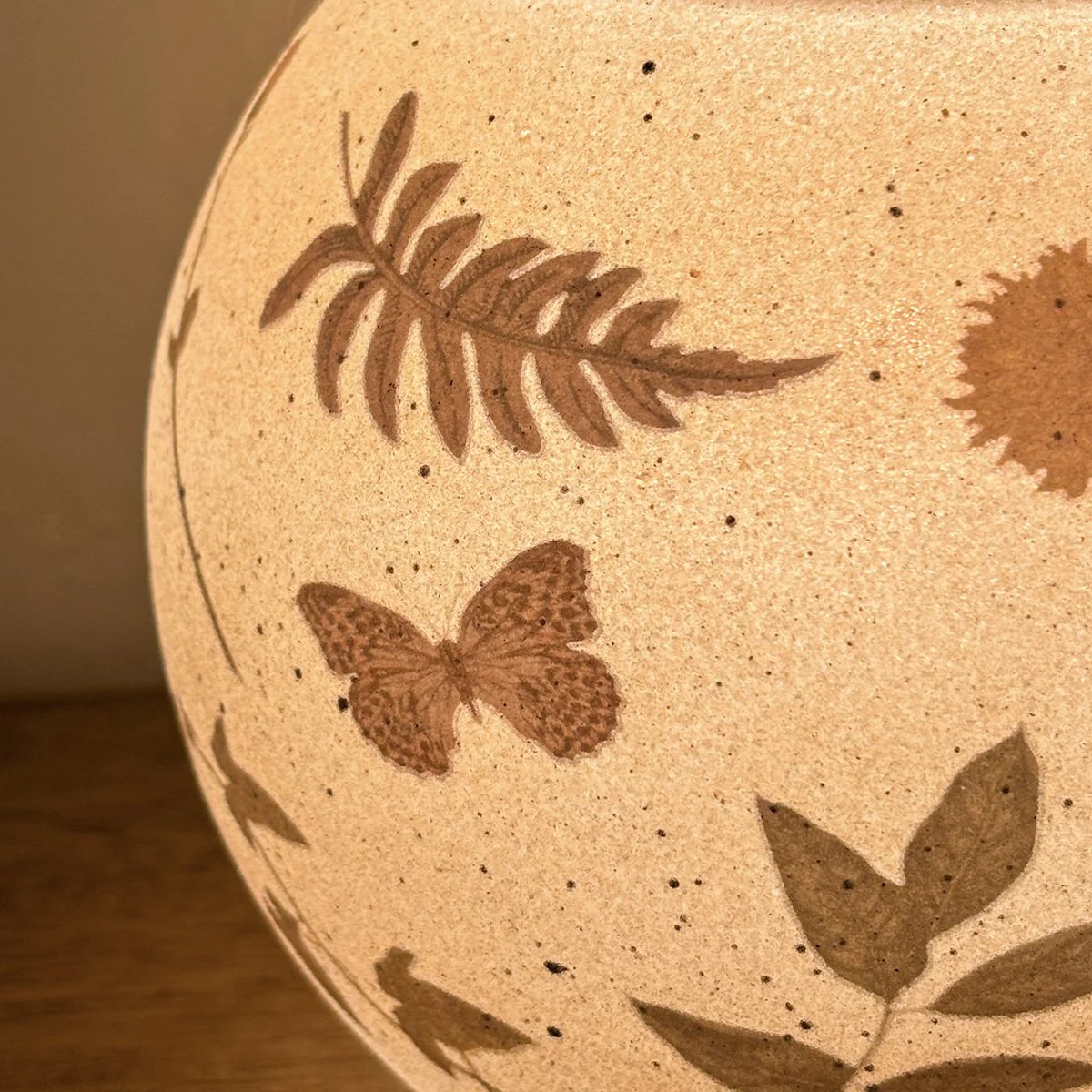 A closer look at the subtle meadow details that make this warmer feel organic, soft, and timeless.