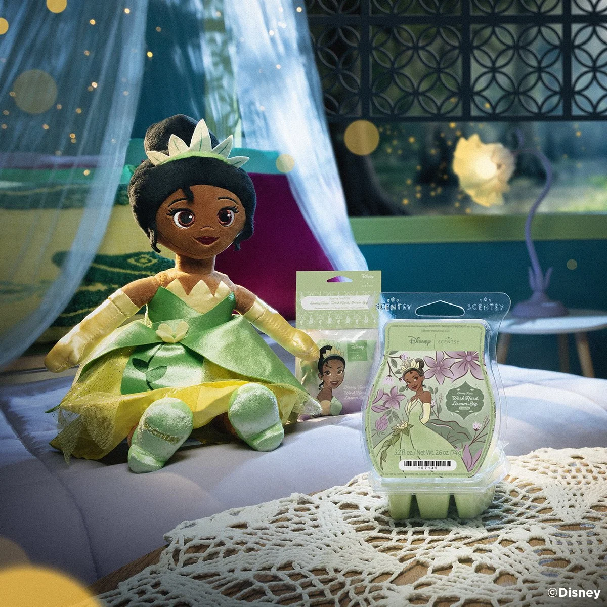 Disney Princess Tiana Scentsy Buddy with Work Hard, Dream Big Scentsy Wax Bar displayed on a table in a softly lit room inspired by The Princess and the Frog