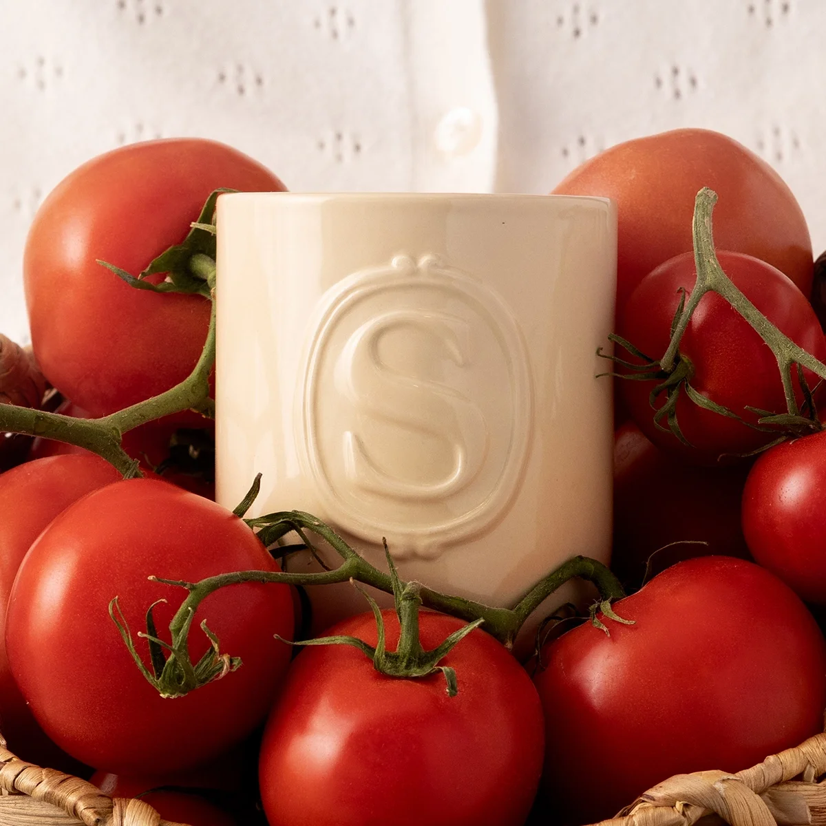 Heirloom Tomato Scentsy Candle styled with fresh red tomatoes on vine in rustic kitchen setting