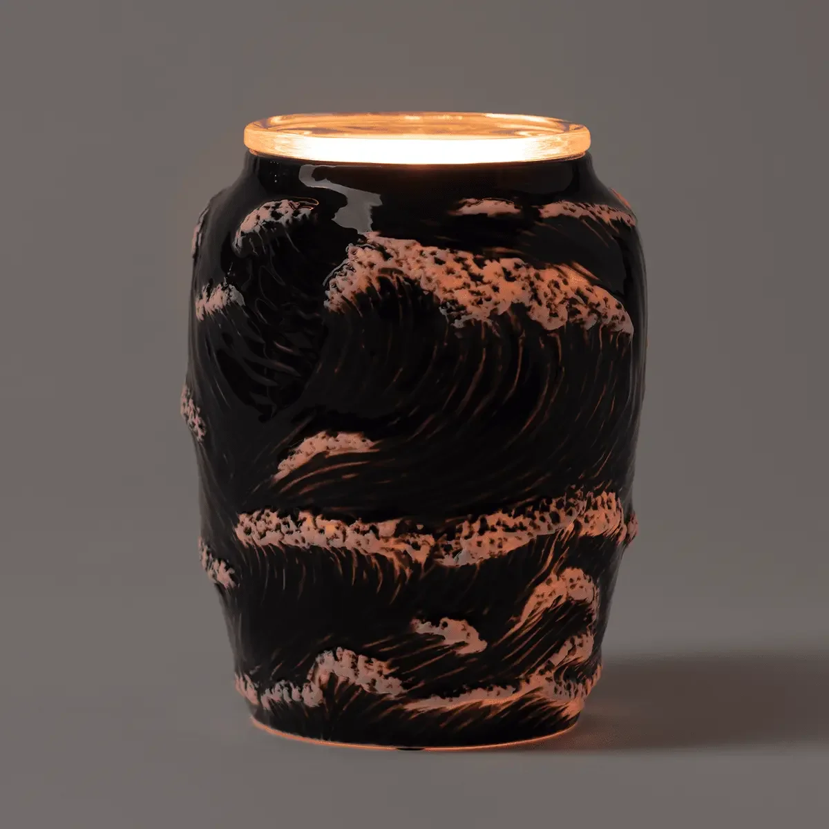 Scentsy Ocean Crest warmer illuminated showing ocean wave pattern