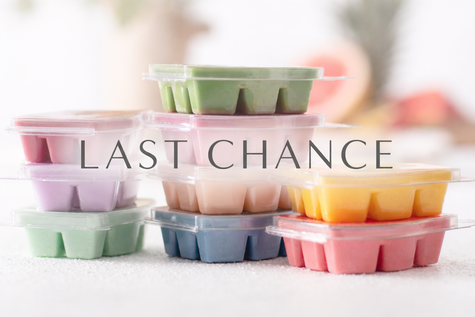 Stacked Scentsy wax bars in assorted colours with large ‘Last Chance’ text overlay, highlighting discontinued Scentsy products available in Canada
