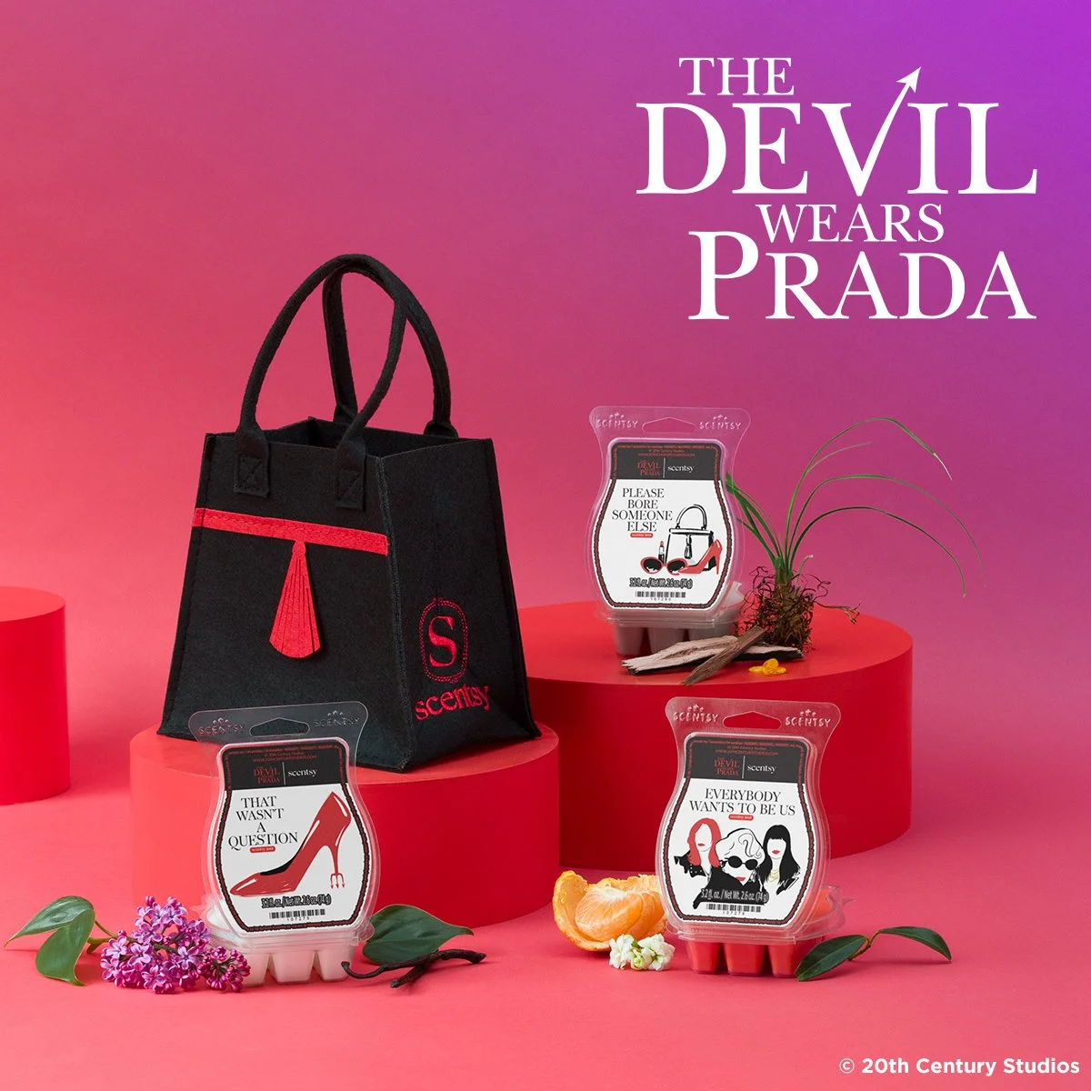 Scentsy Devil Wears Prada wax collection with three bars and black felt bag on pink background