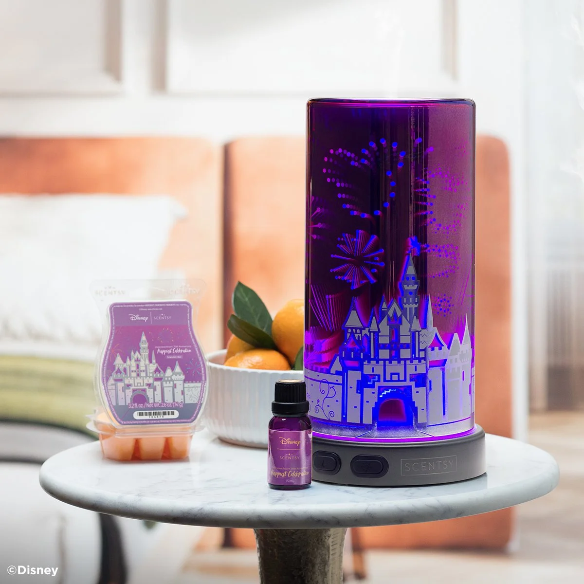 Disneyland Resort 70th Anniversary Scentsy Collection styled with the Sleeping Beauty Castle Scentsy Diffuser, Happiest Celebration Scentsy Bar, and Scentsy Natural Oil