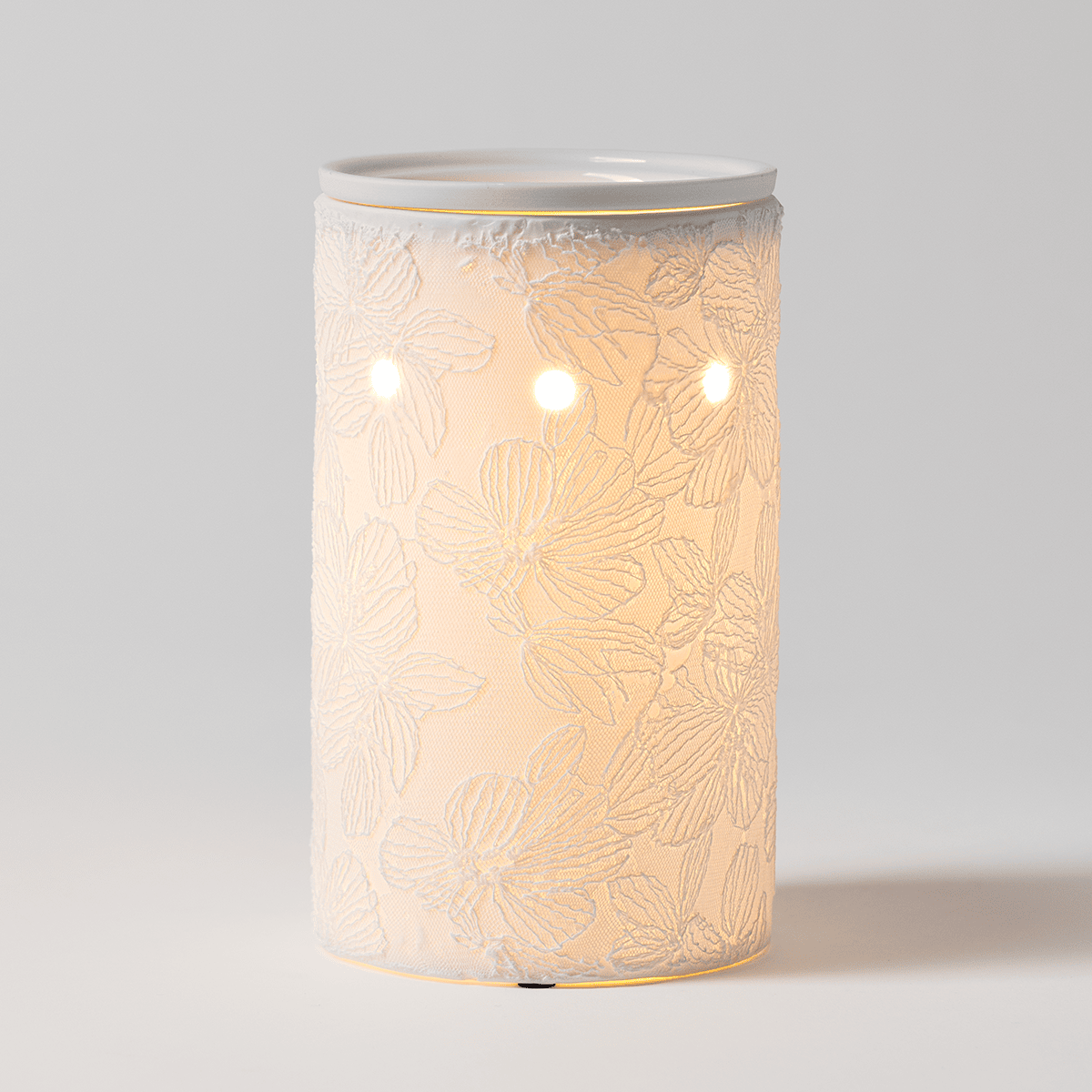 Lace & Light Scentsy Warmer with textured porcelain finish and soft glowing light.