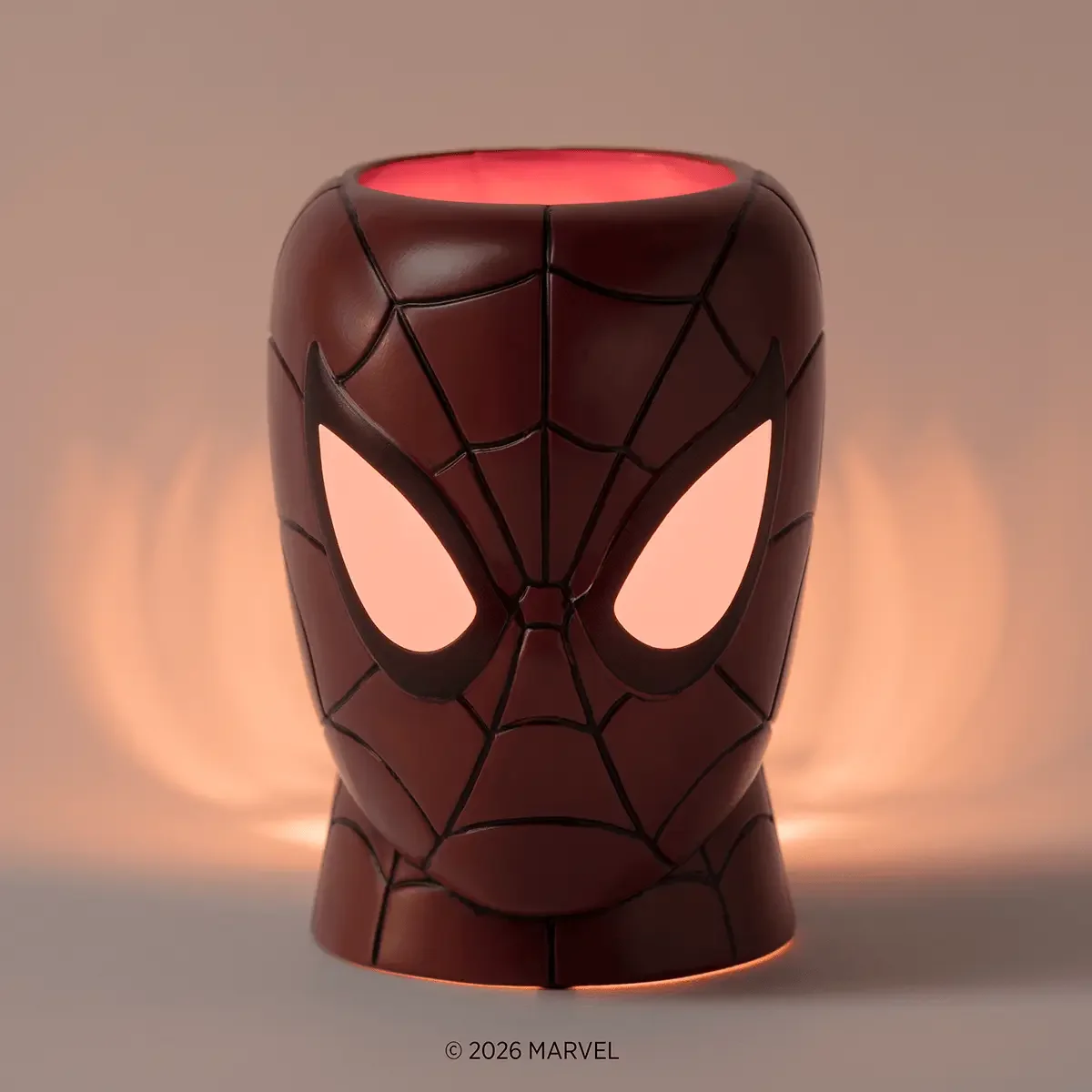 Amazing Spider-Man Scentsy Warmer illuminated in low light with glowing Spider-Man eyes