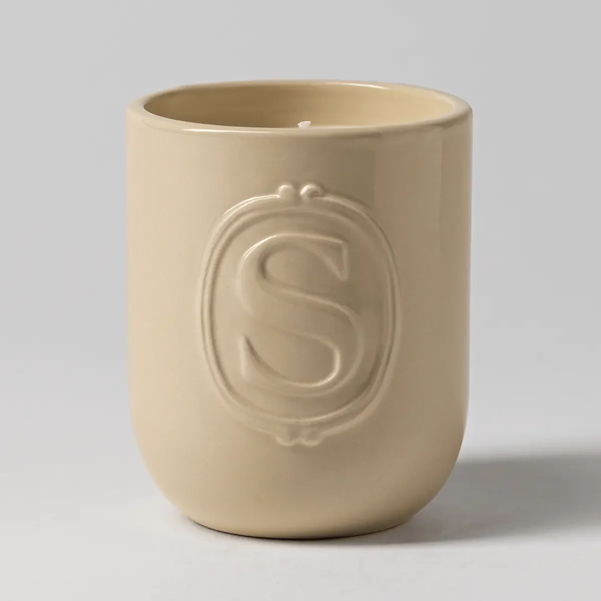 Sunlit Peach Scentsy Candle in soft neutral ceramic jar with embossed Scentsy logo