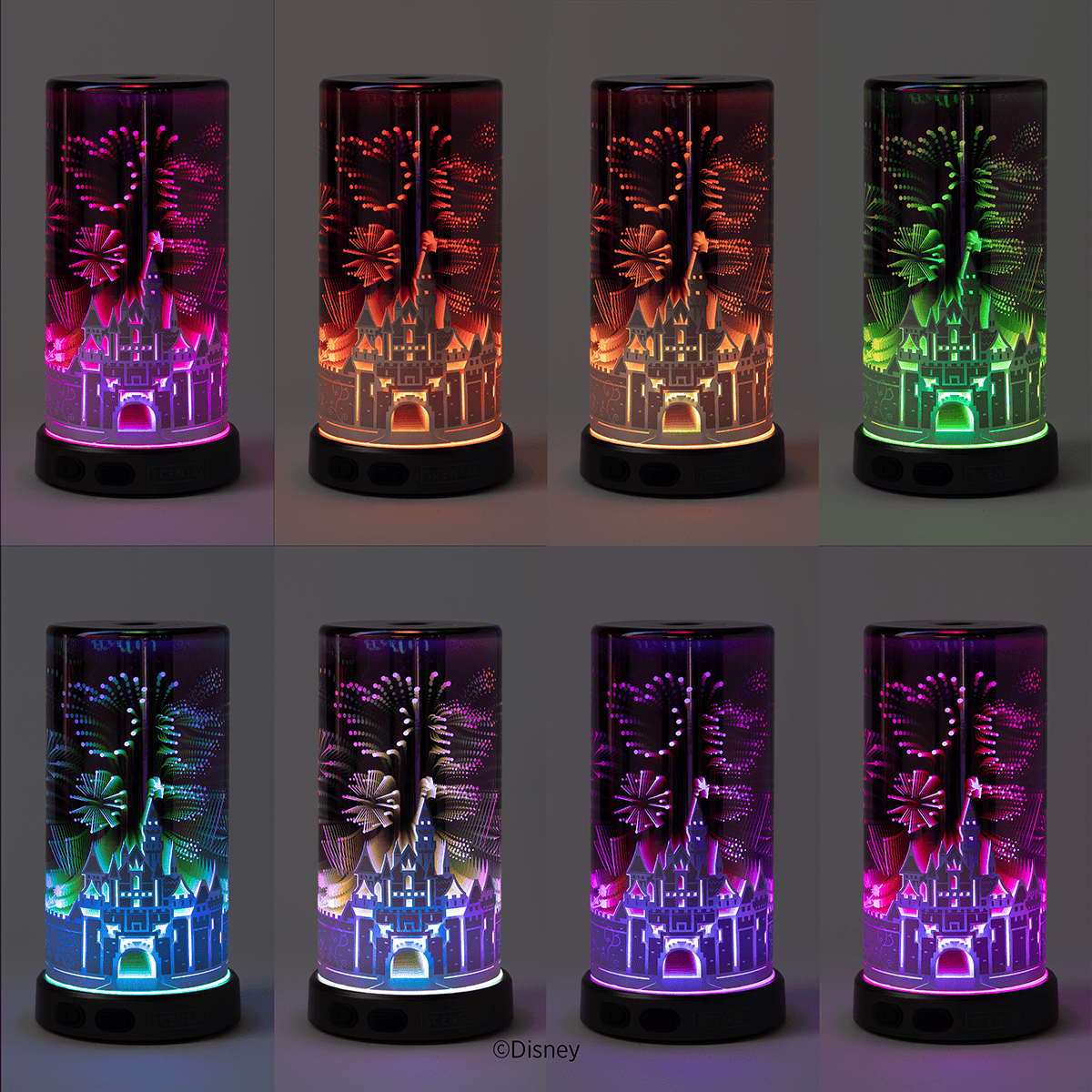 The Sleeping Beauty Castle Scentsy Diffuser displayed in multiple lighting modes, showcasing the variety of colour and glow effects available in the Disneyland Resort 70th Anniversary Celebration diffuser.