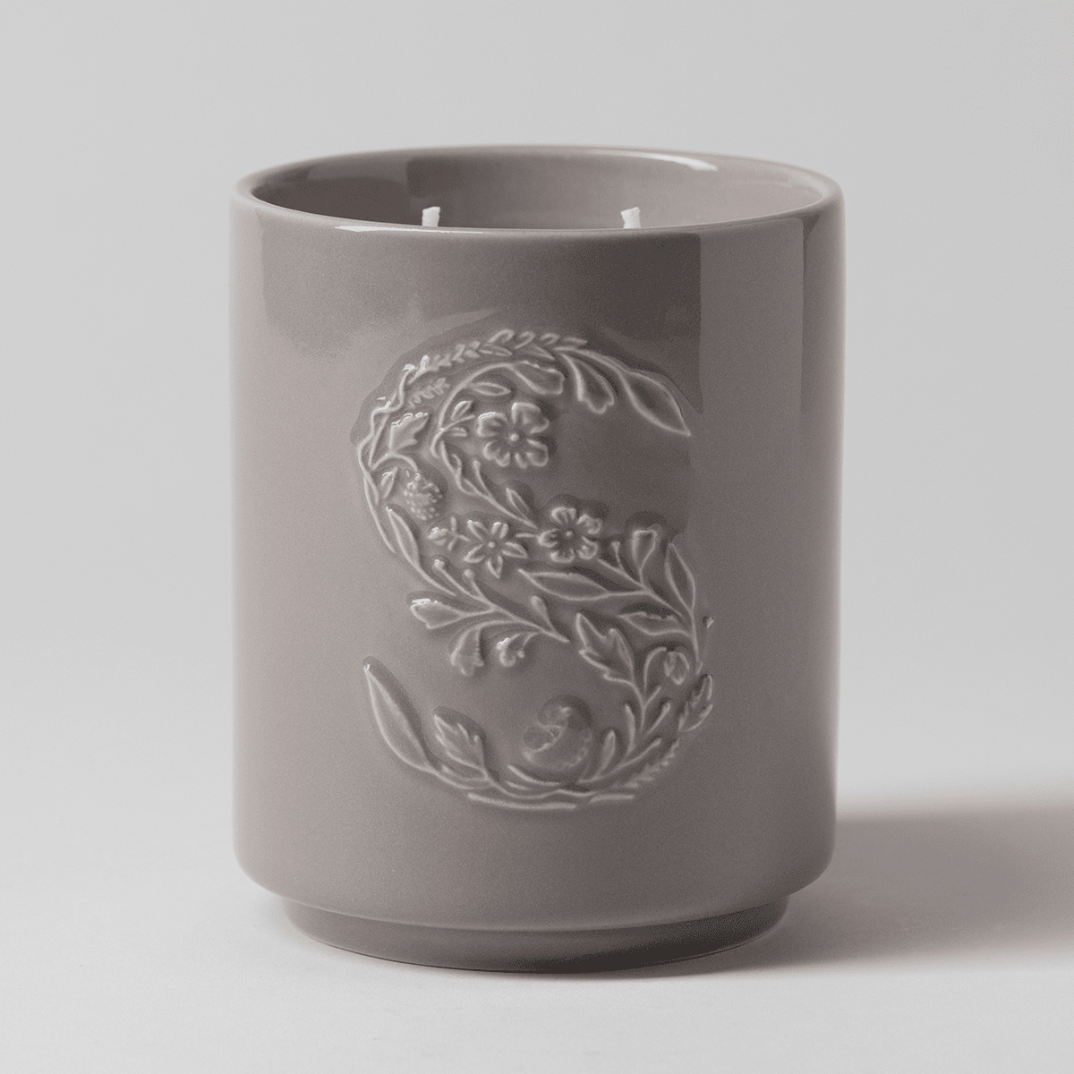 Cocoa Cashmere Scentsy Candle displayed unlit against a soft grey background