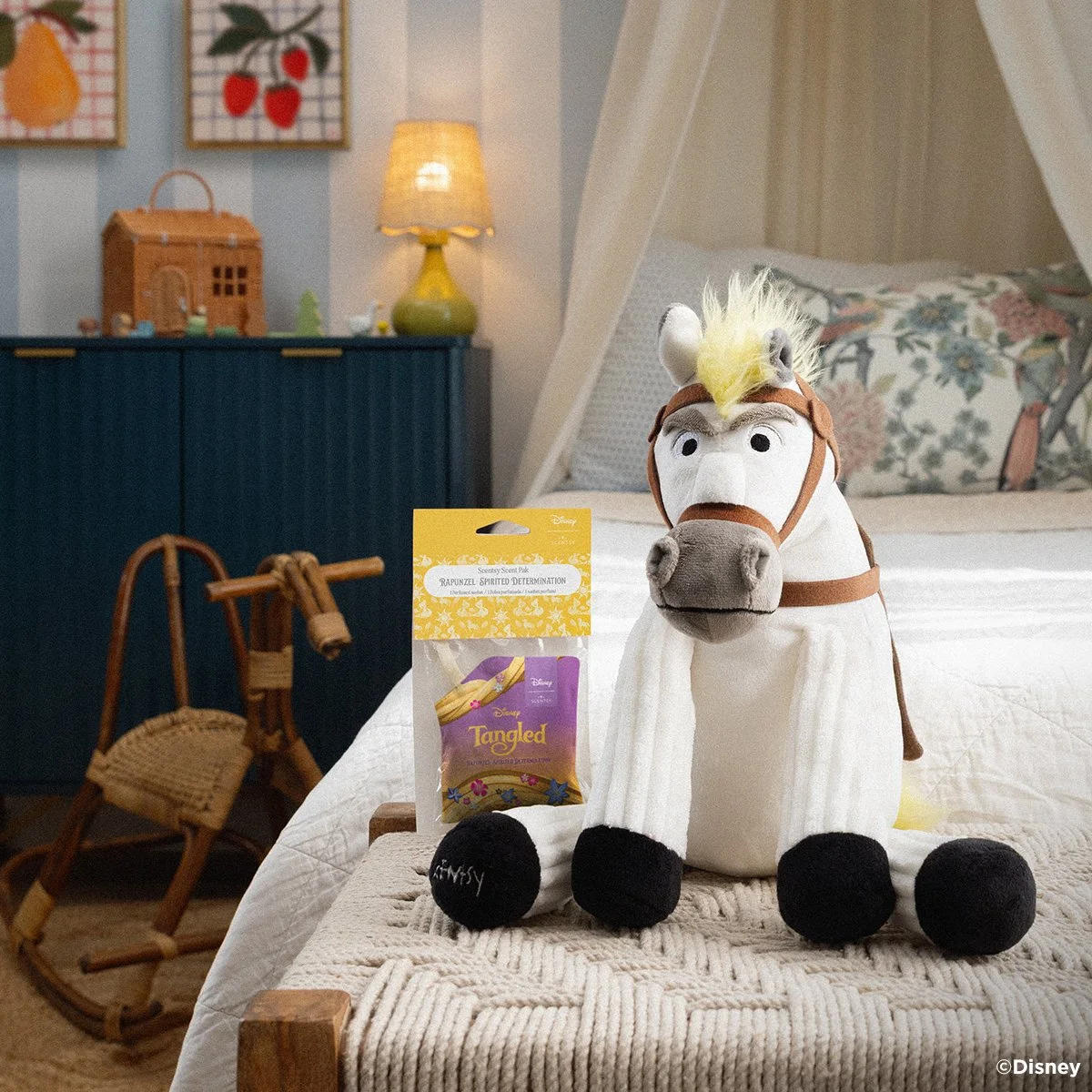Disney Maximus Scentsy Buddy with Rapunzel Spirited Determination fragrance styled on a couch