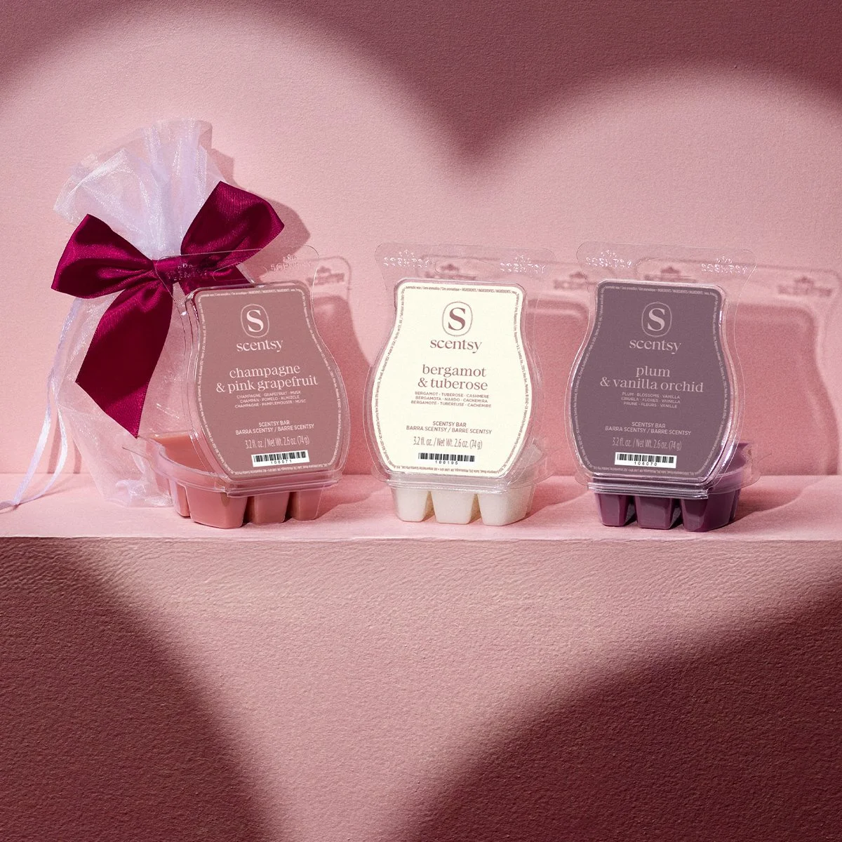 A trio of Valentine’s Day Scentsy wax bars showcasing floral, fruity, and cozy fragrance notes — perfect for setting the mood or gifting someone special.