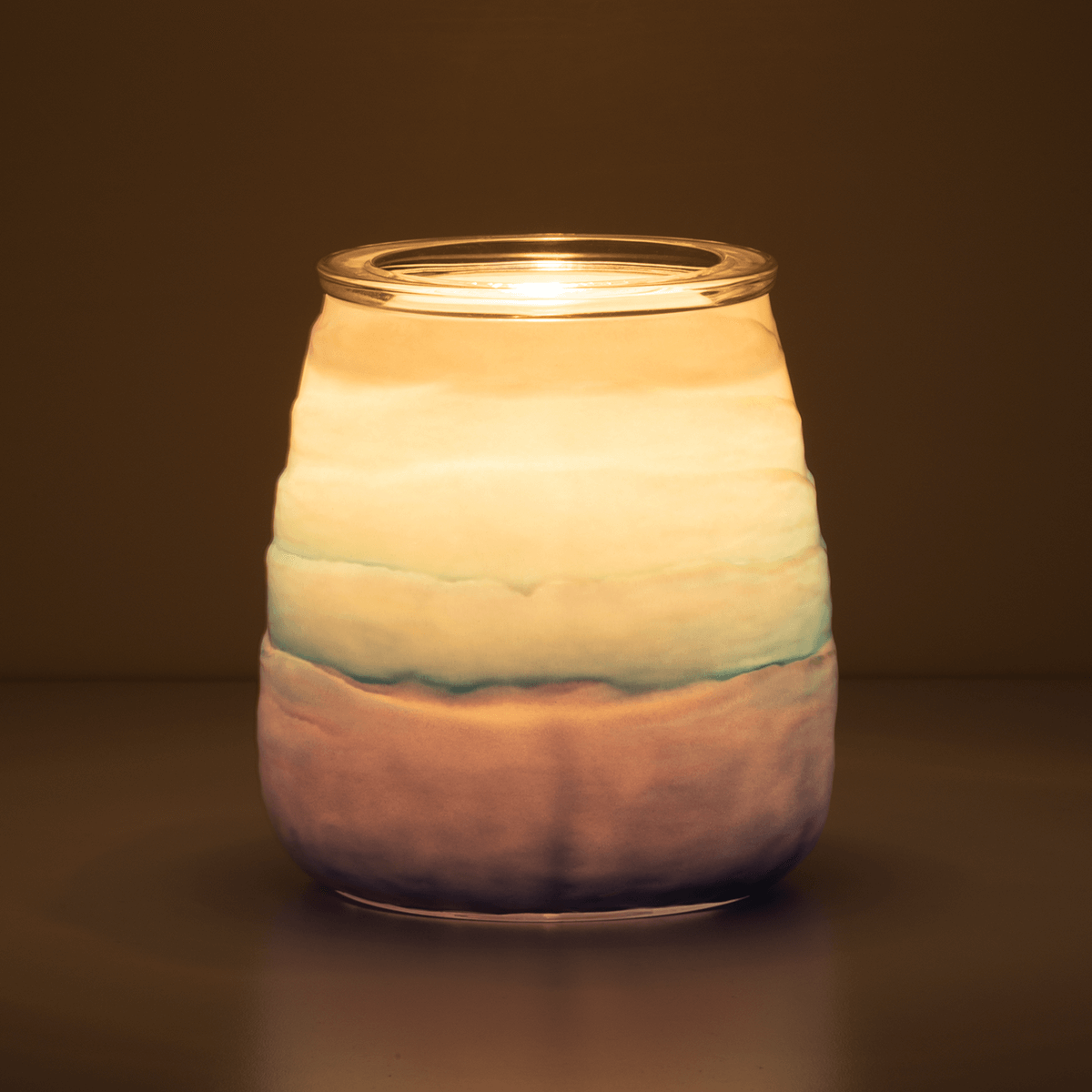 Ocean Ombre Scentsy Warmer in a dark room glowing
