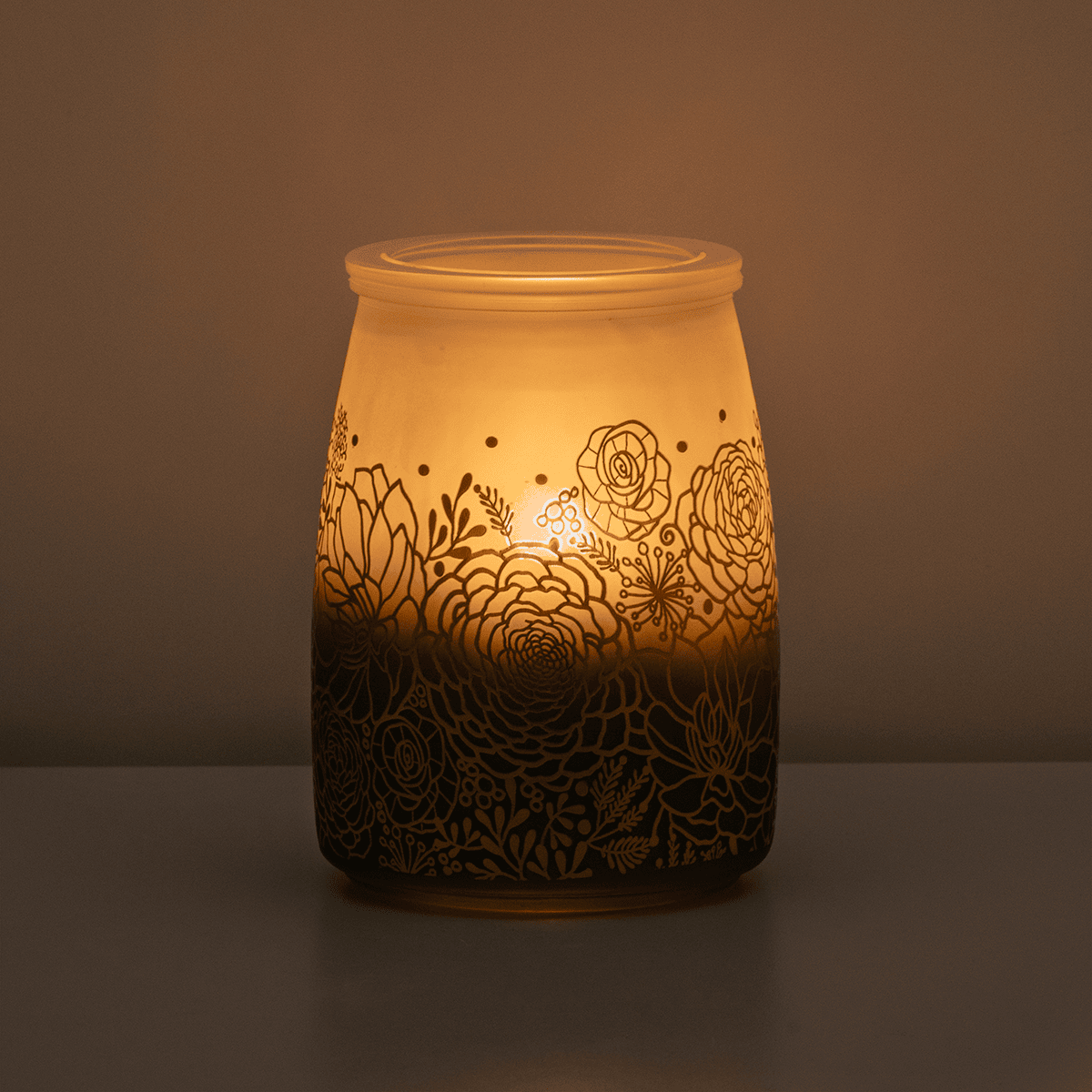 Tranquil Glow Scentsy Warmer glowing softly in a dark room