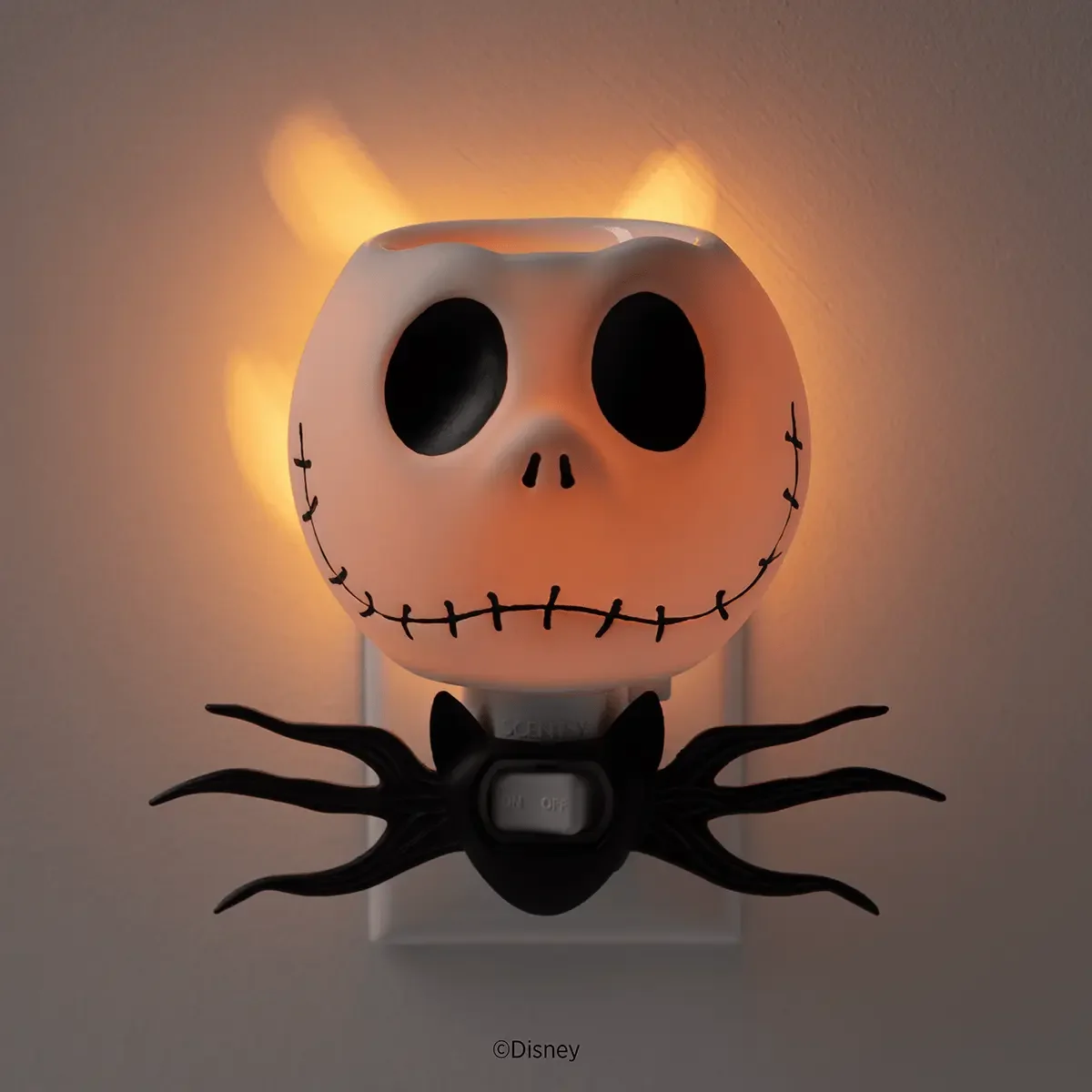 Disney Jack Skellington Scentsy Mini Warmer illuminated in a dark room