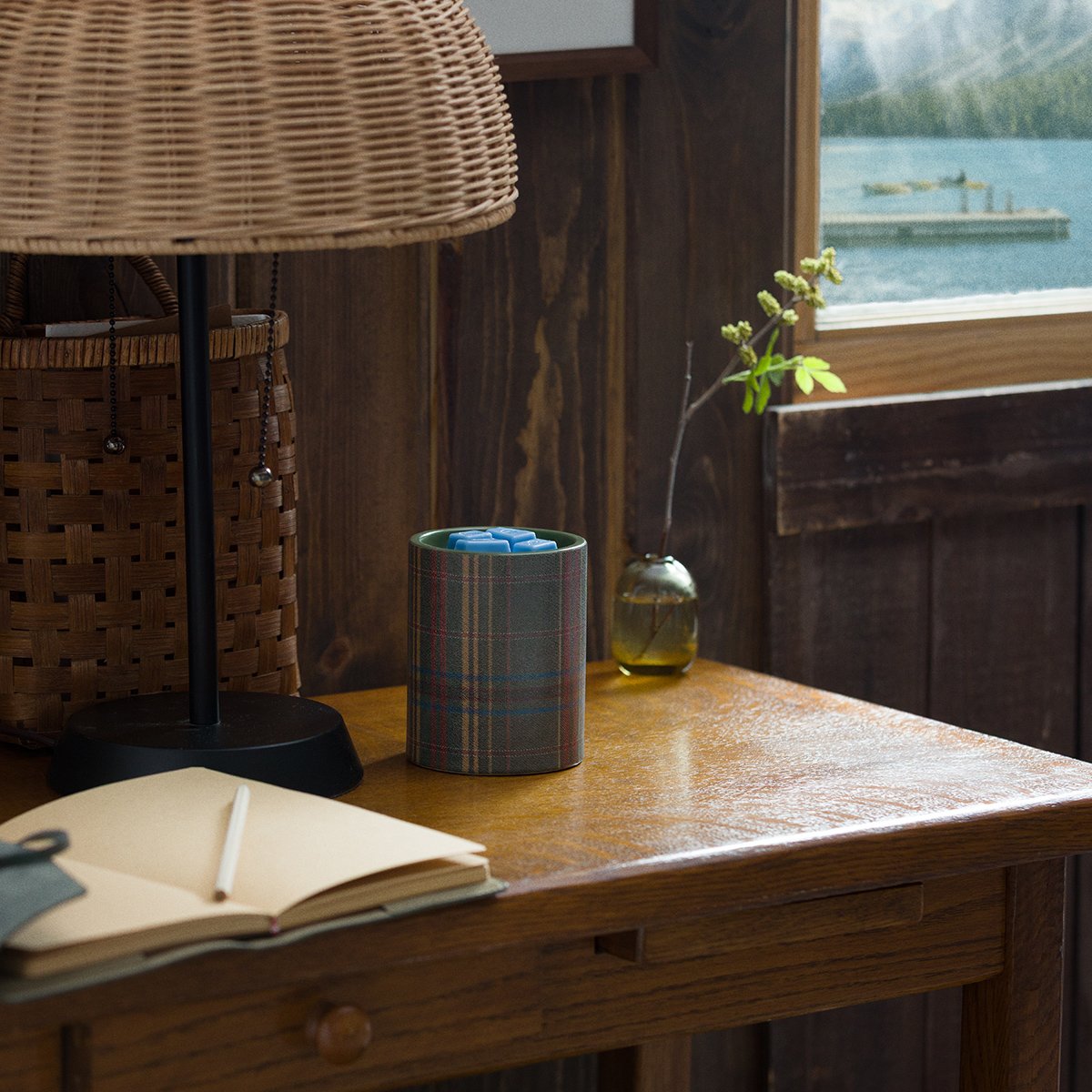 Scentsy Elmwood Warmer with plaid design styled on a wooden desk in a cozy lakeside cabin