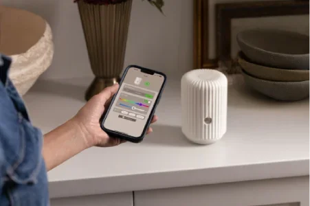 White Scentsy smart fragrance diffuser controlled through a smartphone app