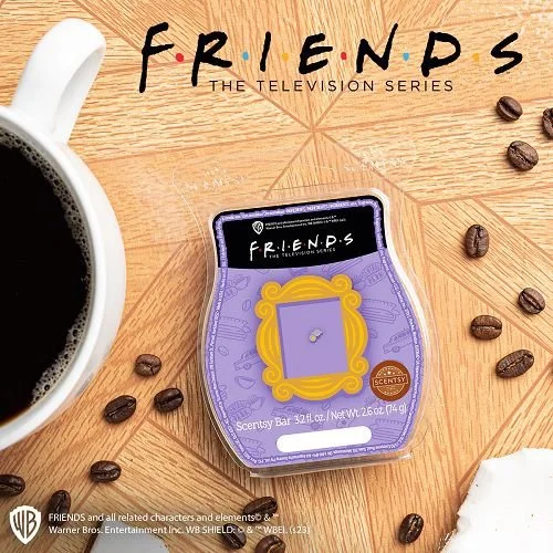 Friends Scentsy wax bar inspired by Central Perk coffee scent with espresso notes displayed beside coffee cup and beans