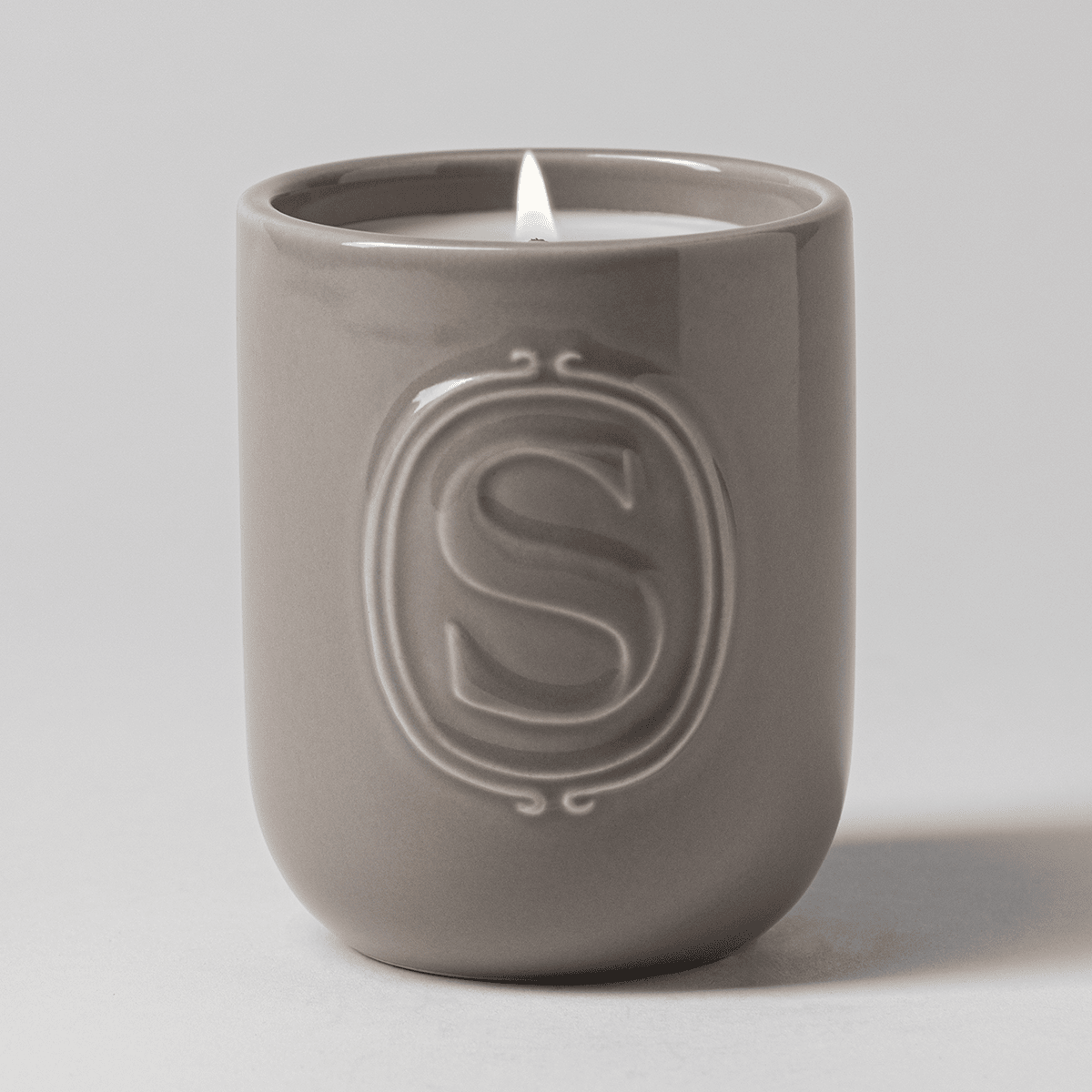 Mystery Man Scentsy Candle lit with a flame