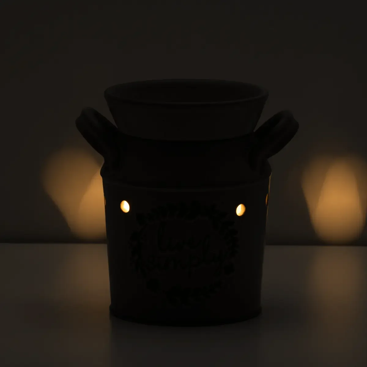 Live Simply Scentsy Warmer in a dark room glowing