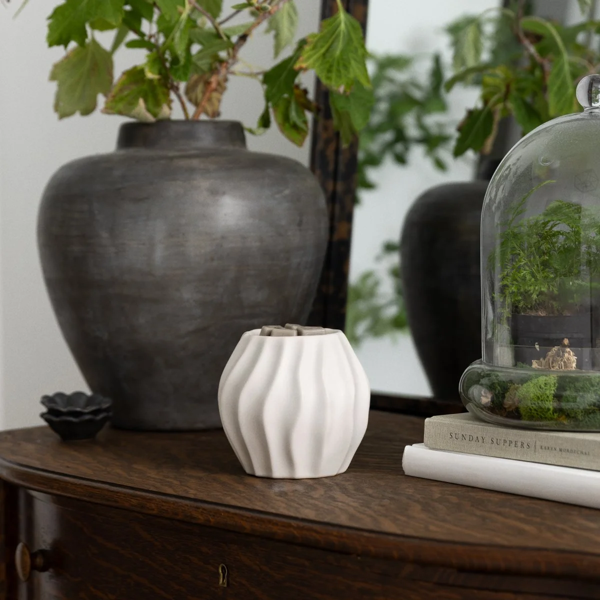 Cascade Scentsy warmer styled on a wooden surface with neutral home décor