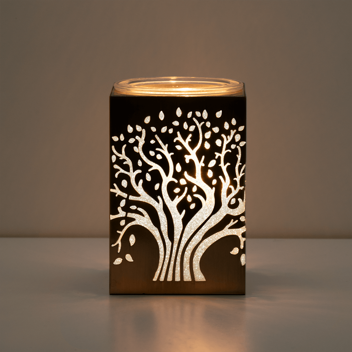 Deep Roots Scentsy Warmer styled in a dark room glowing