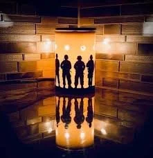 Service & Sacrifice Scentsy Warmer glowing softly in a dark room