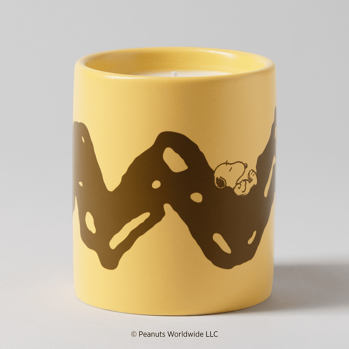 Peanuts Good Grief Scentsy Candle featuring Charlie Brown's iconic zigzag shirt design with Snoopy resting along the pattern