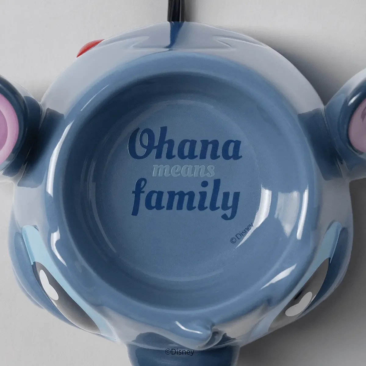 Disney Stitch Warm Fuzzies Scentsy Warmer showing the wax dish engraved with the phrase "Ohana means family"