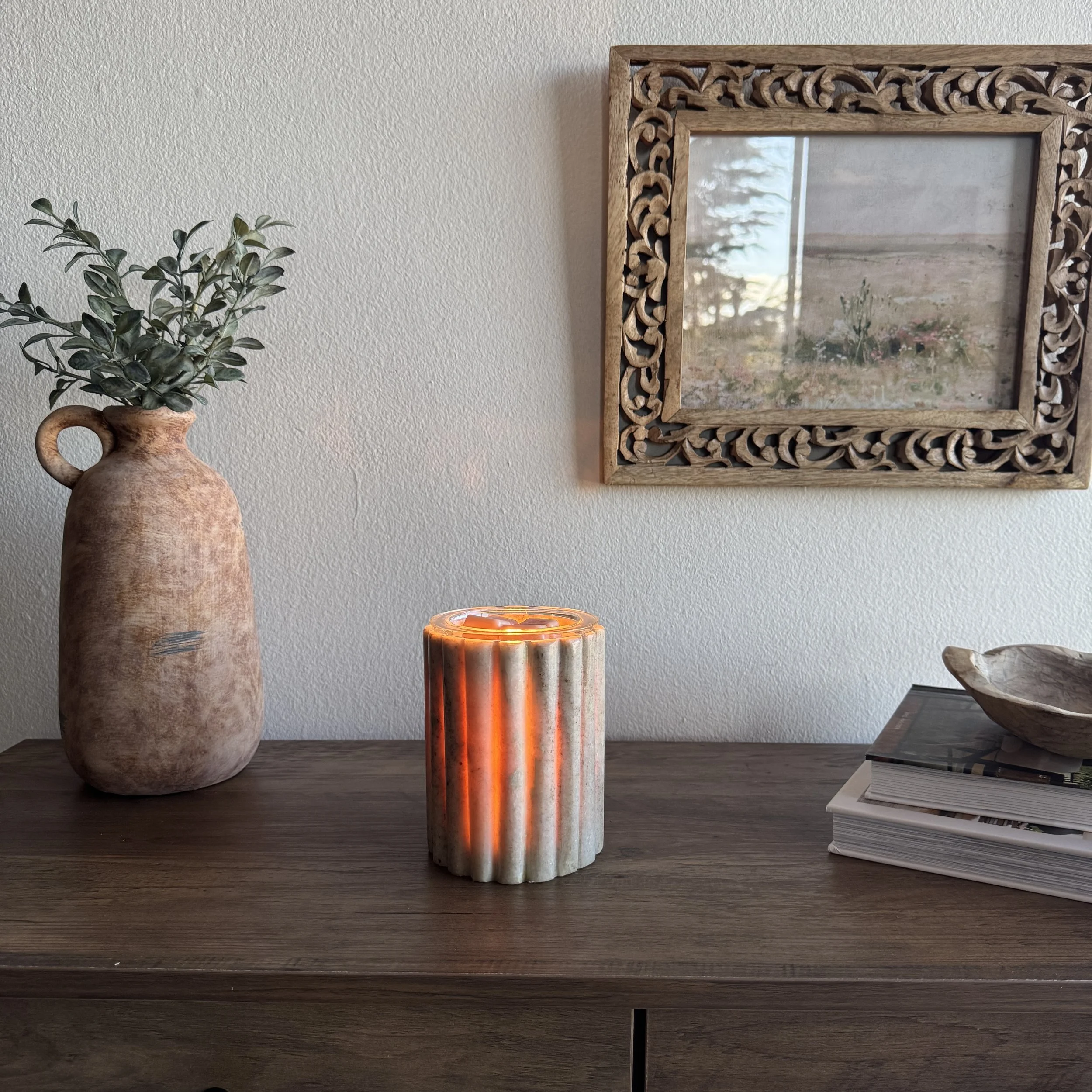 Morchana Marble Scentsy warmer glowing on a wood surface with neutral décor