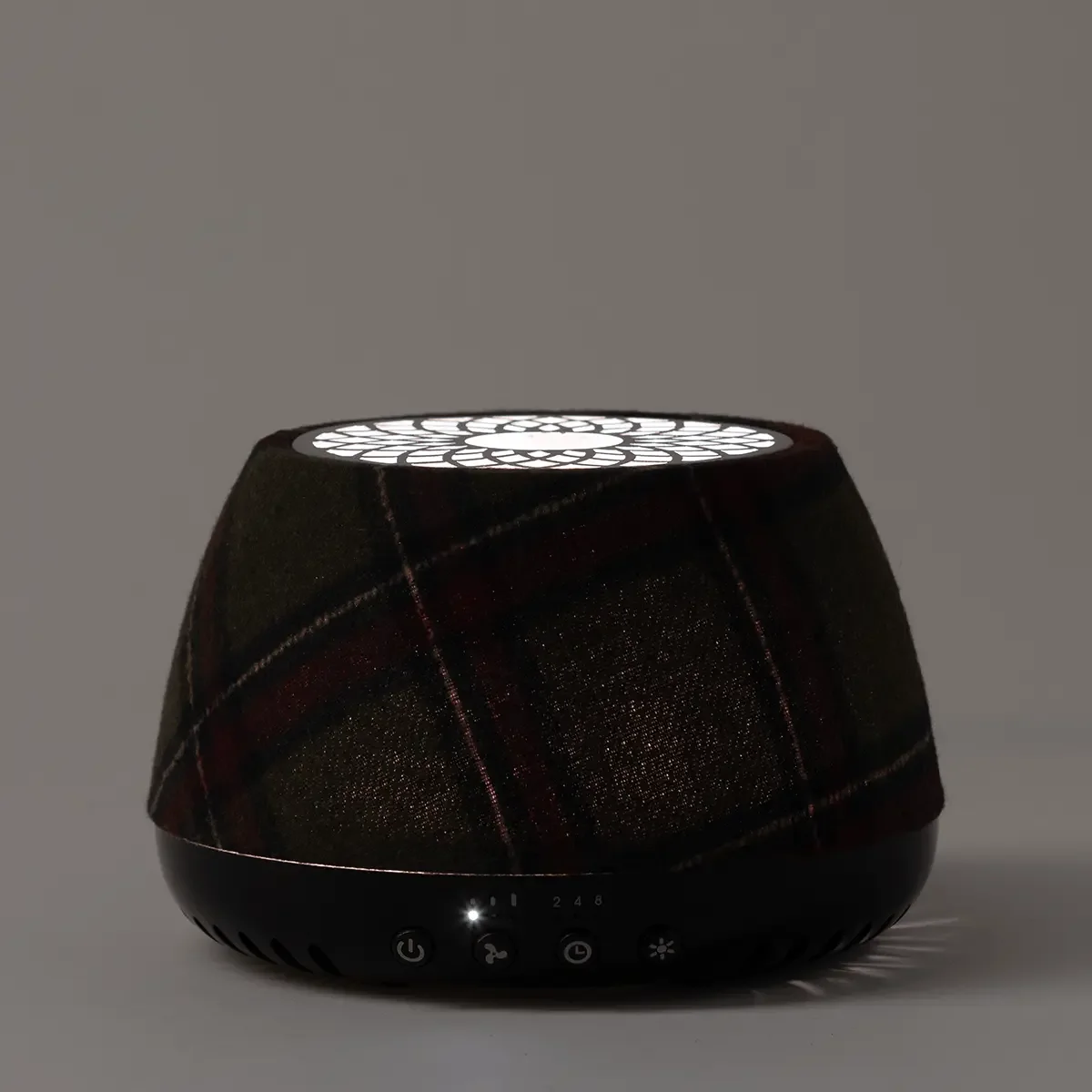 Scentsy Air Quad Black – Plaid illuminated in a dark room showing its decorative lighted top