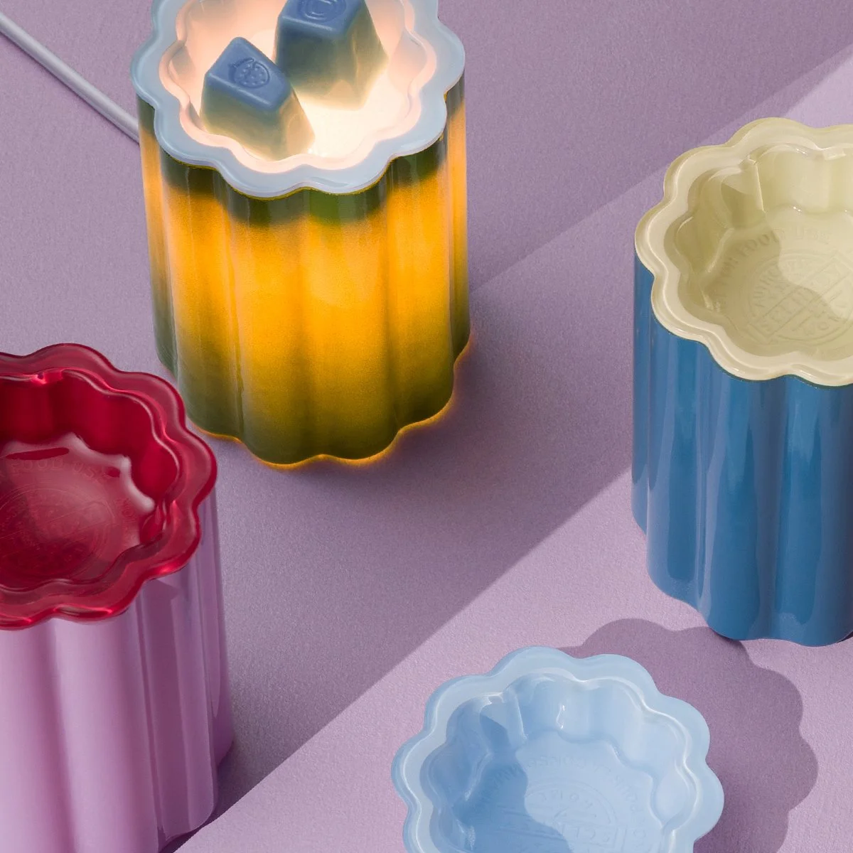 Three Bloomie Collection Scentsy warmers styled together in a colourful, expressive home setting, showcasing bold florals and vibrant tones that celebrate individuality and maximalist décor.