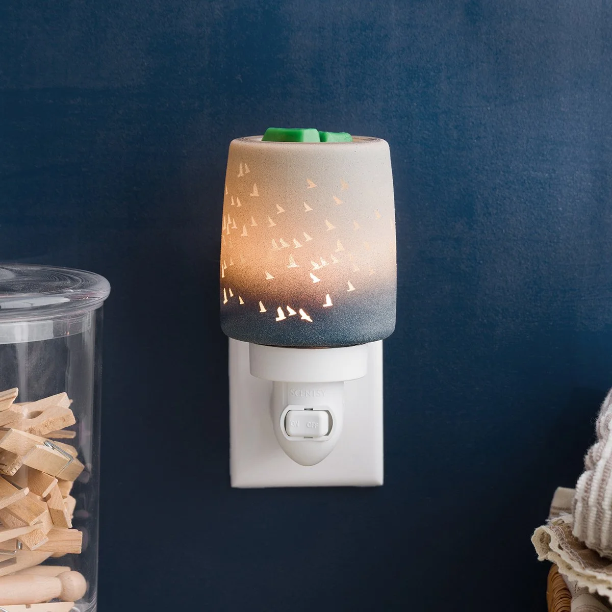 Scentsy Waves and Wings mini warmer styled on wall with coastal decor