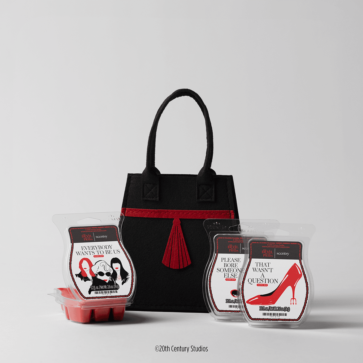 Scentsy Devil Wears Prada wax collection with felt bag and three bars