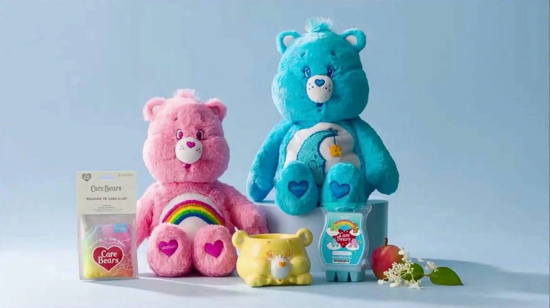 Care Bears scentsy buddies and sunshine bear warmer styled in a blue background
