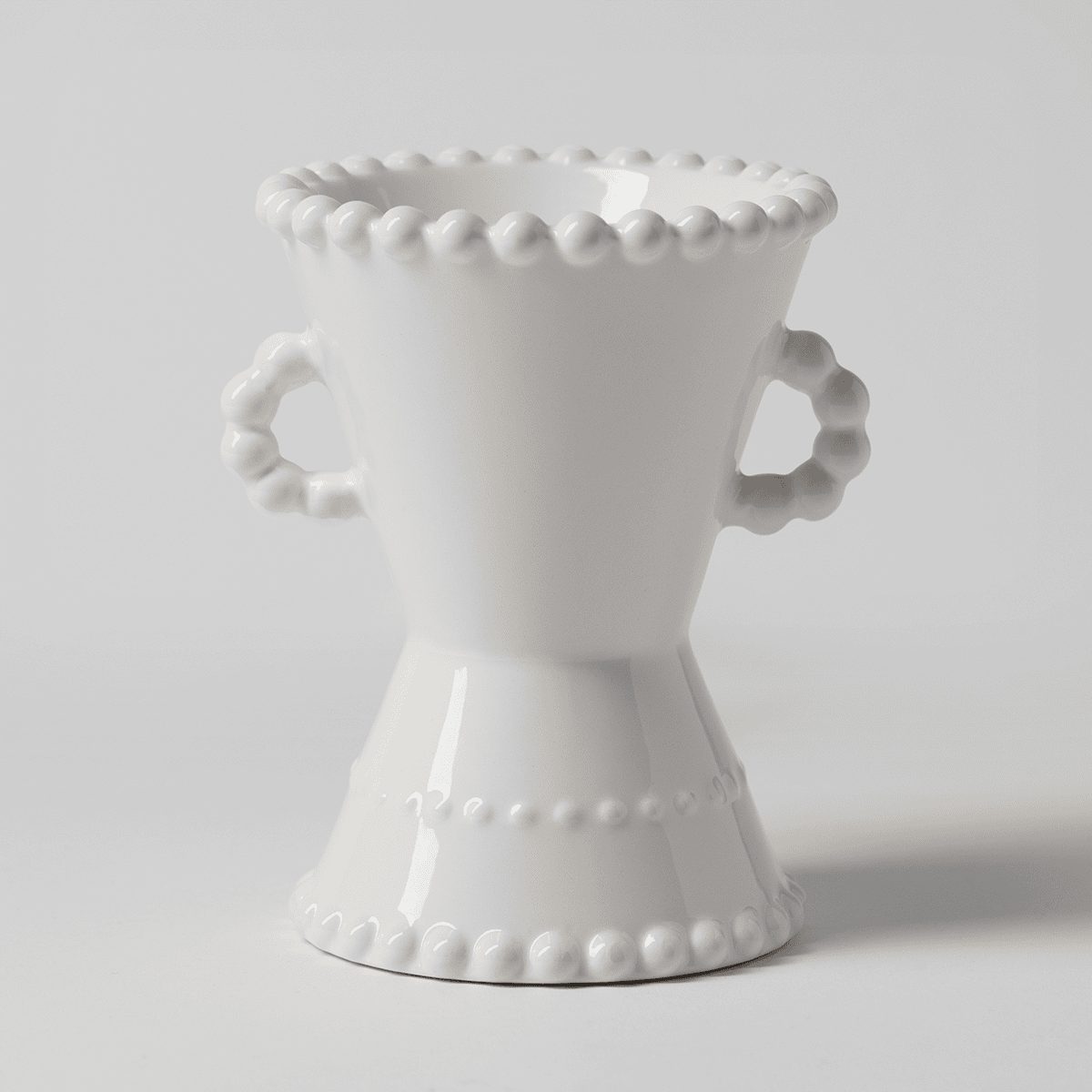 Belaire Scentsy warmer illuminated on a neutral background highlighting its sculpted shape