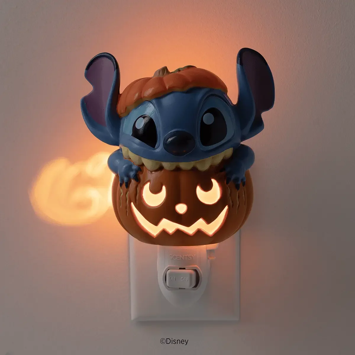 Disney Stitch Pumpkin Trouble Scentsy Mini Warmer illuminated in the dark