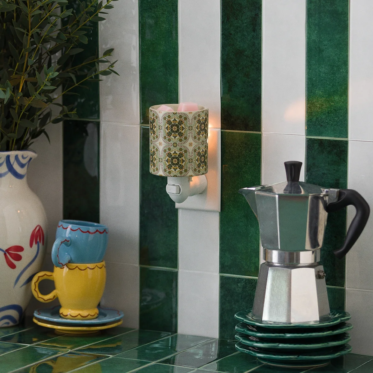 Terrazza Tile Mini Scentsy Warmer displayed in a Mediterranean-inspired kitchen with green tile backsplash and Italian décor