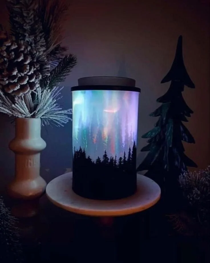 Polar Panorama Scentsy Warmer styled in a dark room highlighting the light display