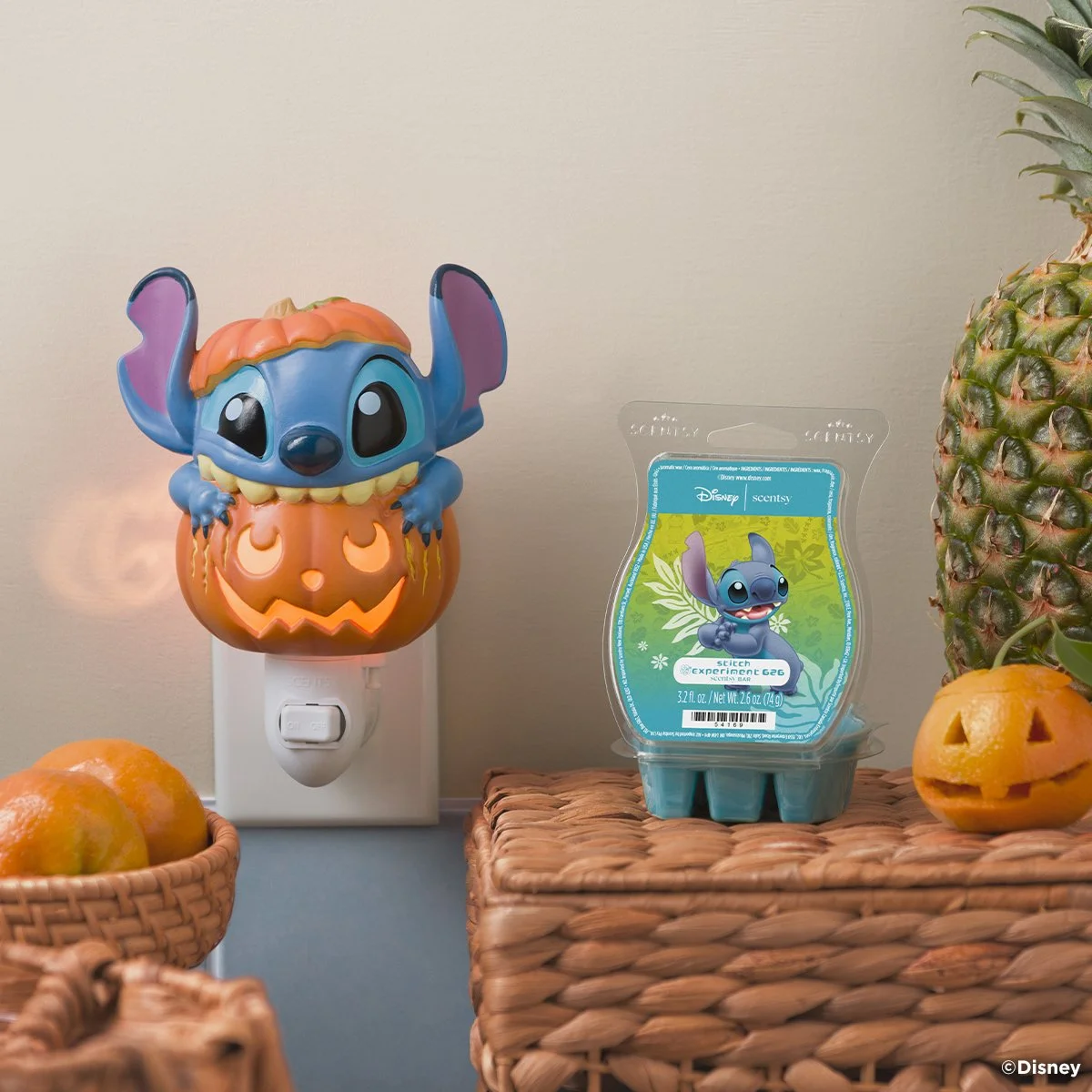 Disney Stitch Pumpkin Trouble Scentsy Mini Warmer glowing beside the Disney Stitch Experiment 626 Scentsy Bar in the Scentsy Harvest Collection 2026