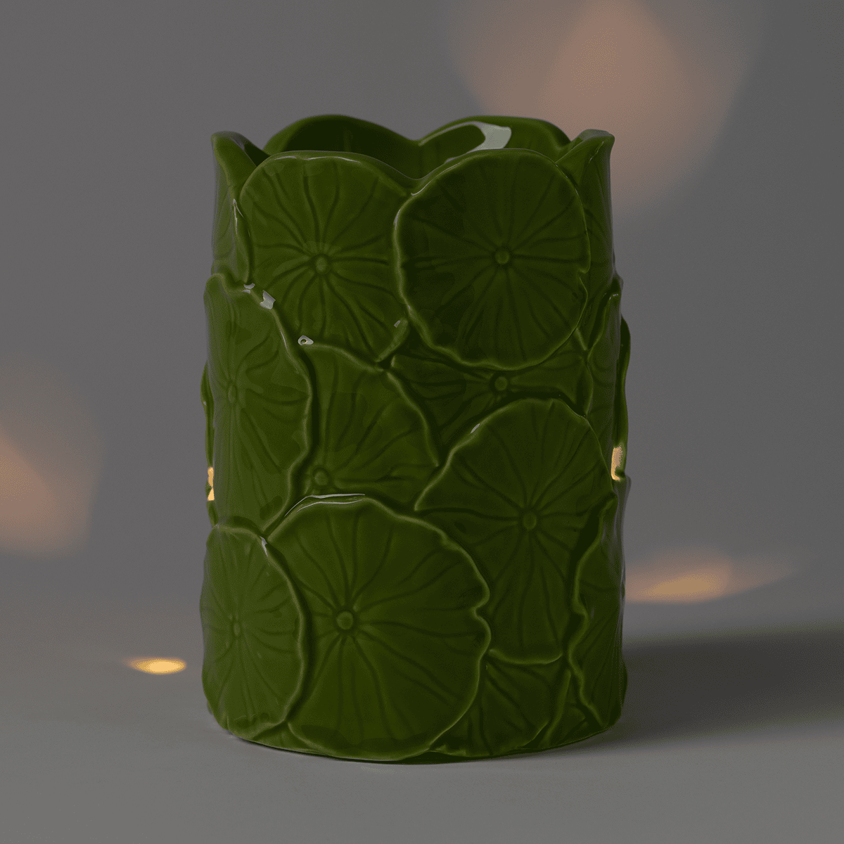 Illuminated Leap & Lily Scentsy Warmer glowing with minimal light showing