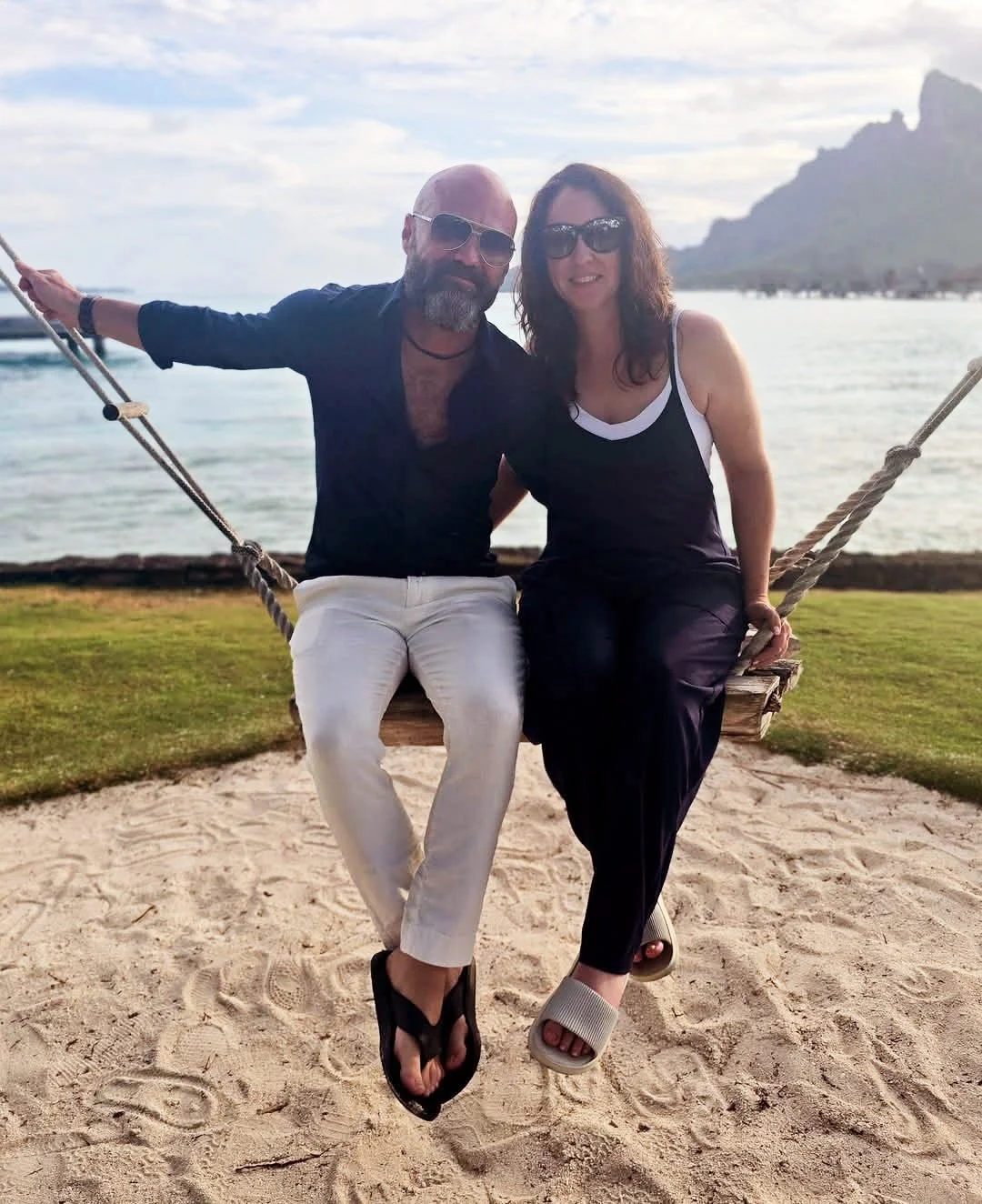 canadian consultant carla hunter with her husband brett powlesland outdoors on a hammock