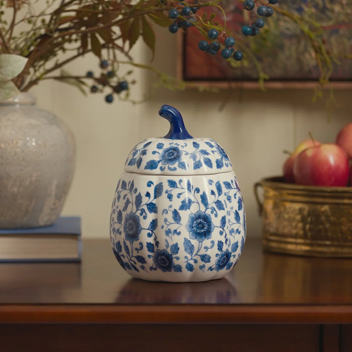 Scentsy Indigo Vine Pumpkin Warmer featuring a blue floral pumpkin design displayed with apples and fall home décor