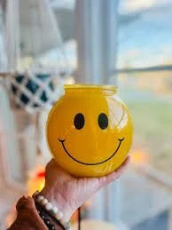 Share a Smile Scentsy Warmer sparkling in front of a sunny window