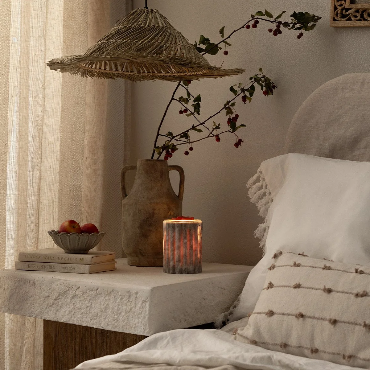 Morchana Marble Scentsy Warmer styled on a bedside table with neutral décor and warm ambient lighting