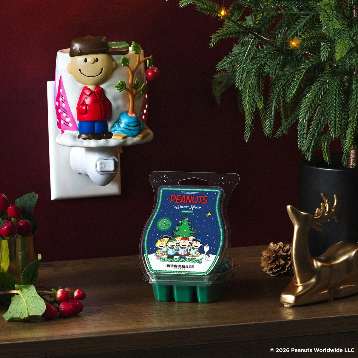Charlie Brown Christmas Scentsy Mini Warmer and A Snoopy Holiday Scentsy Bar displayed with festive decorations
