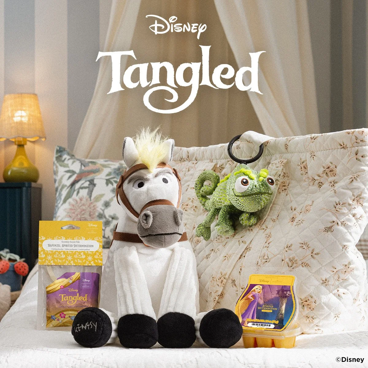 Disney Tangled Scentsy Collection with Maximus and Pascal styled on a bed