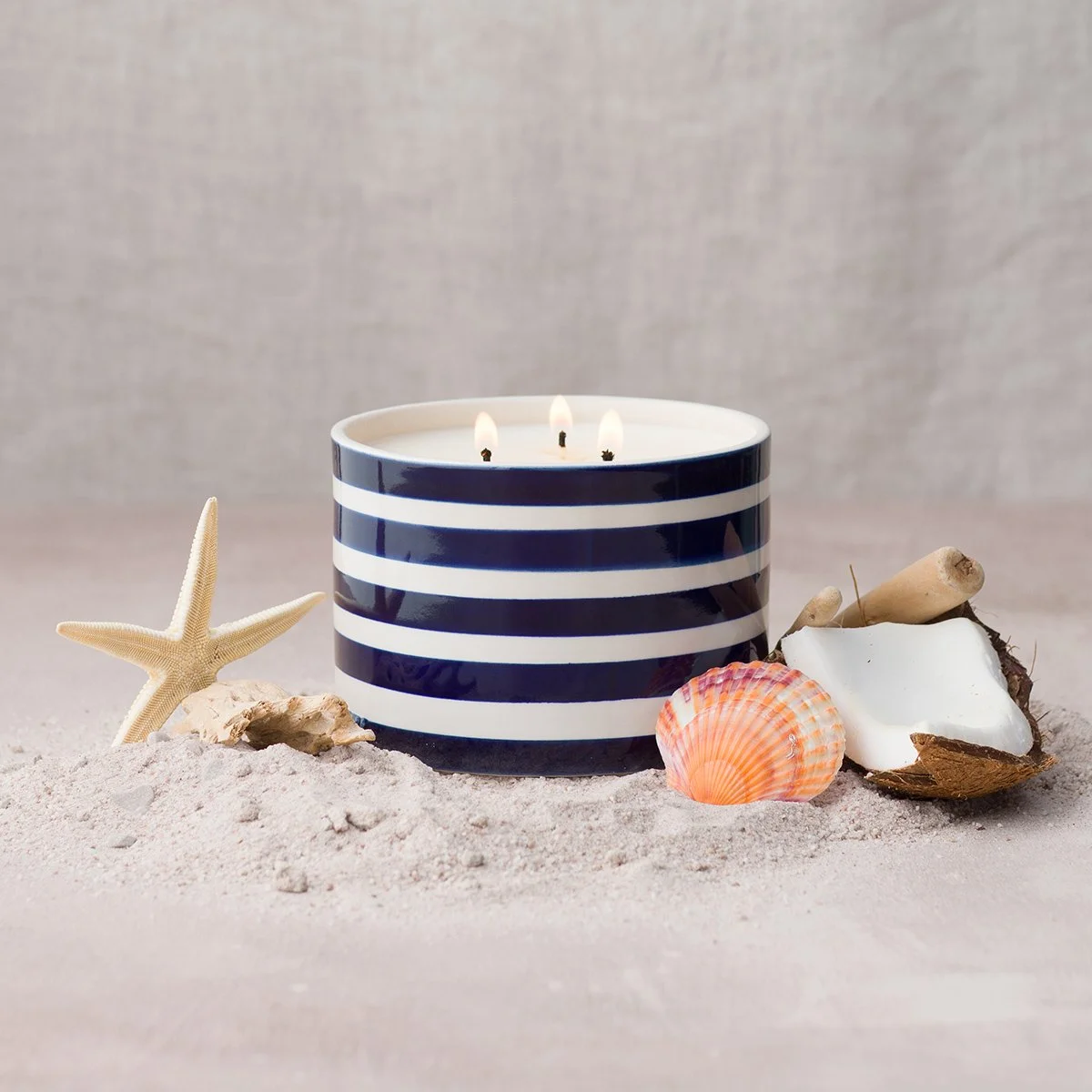 Scentsy April 2026 Coastal Collection striped candle with seashells and sand beach styling