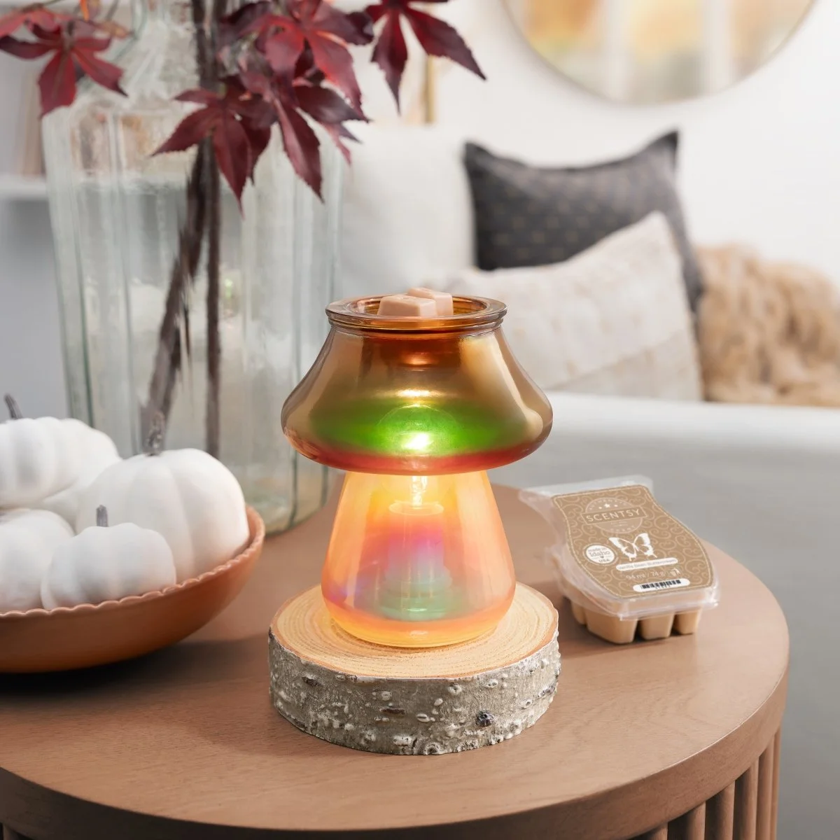Amanita Scentsy Warmer styled on a table in a bright living room with warm glow
